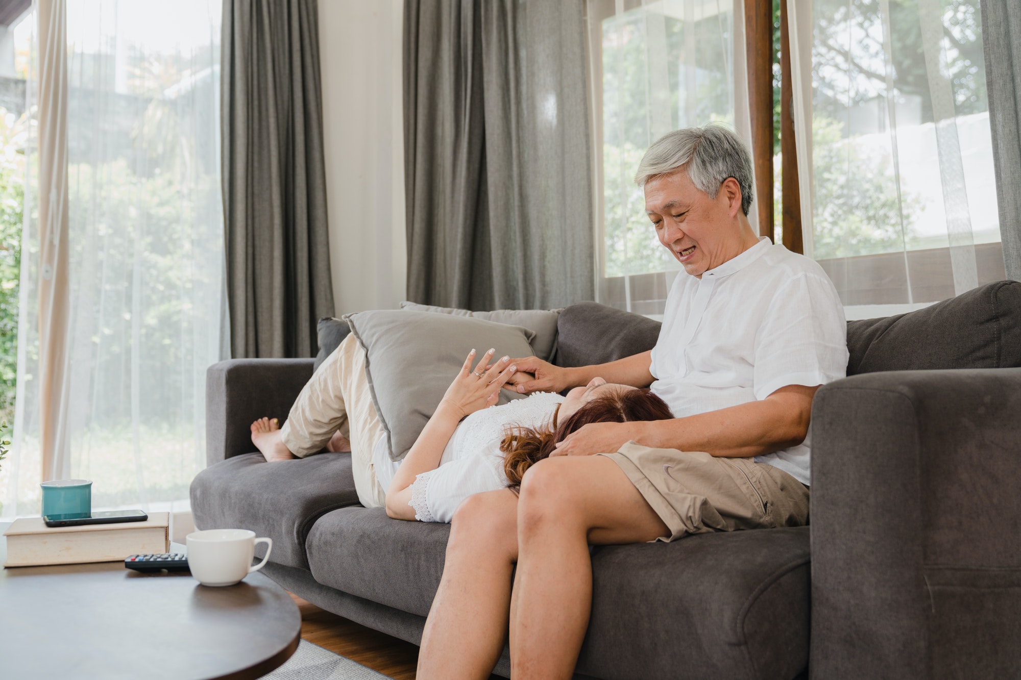 Asian senior couple relax at home.