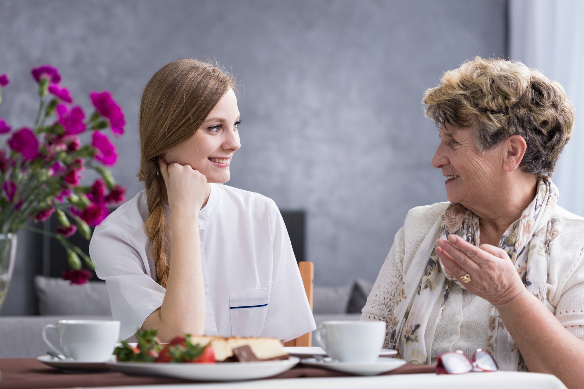 Senior woman talking with carer